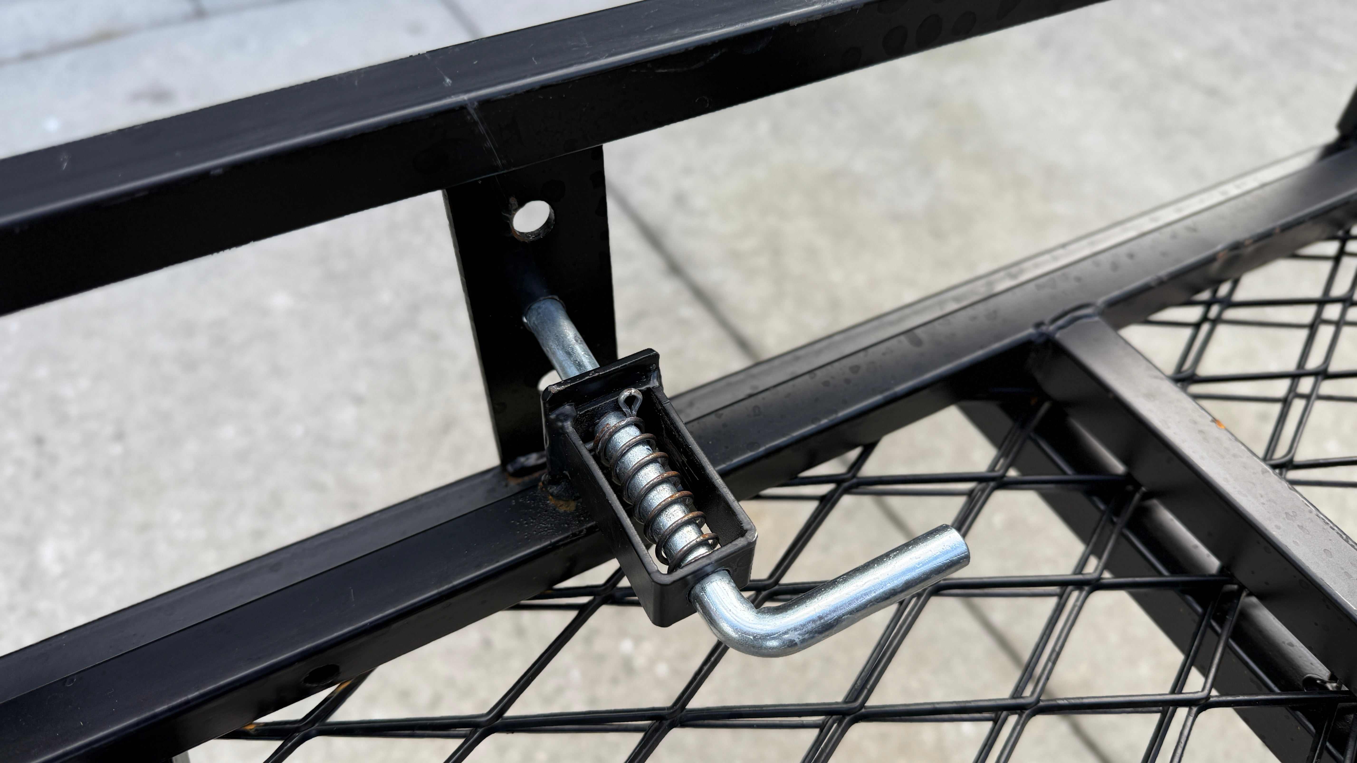 eTrike secured on hitch cargo rack with ratchet straps