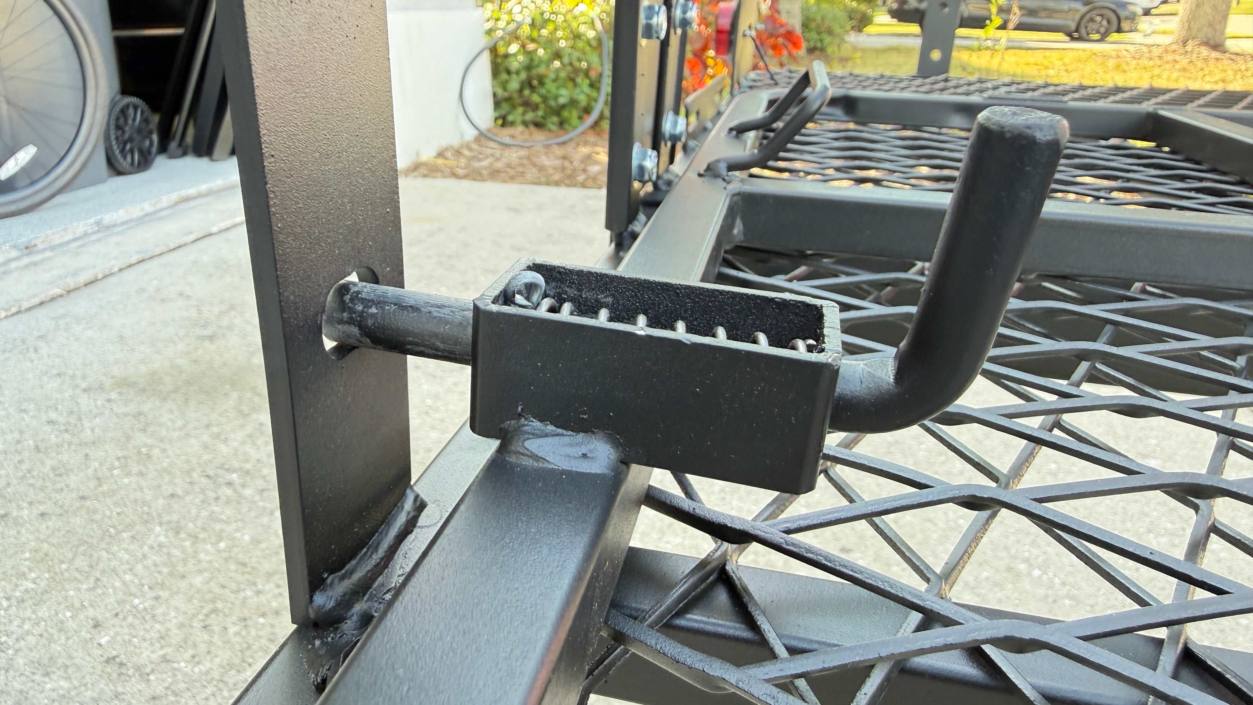 eTrike rack locking hitch pin detail close-up